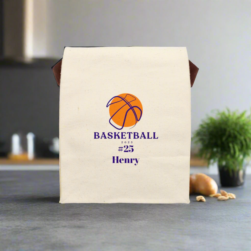 Beige bag with basketball design and text on a gray surface