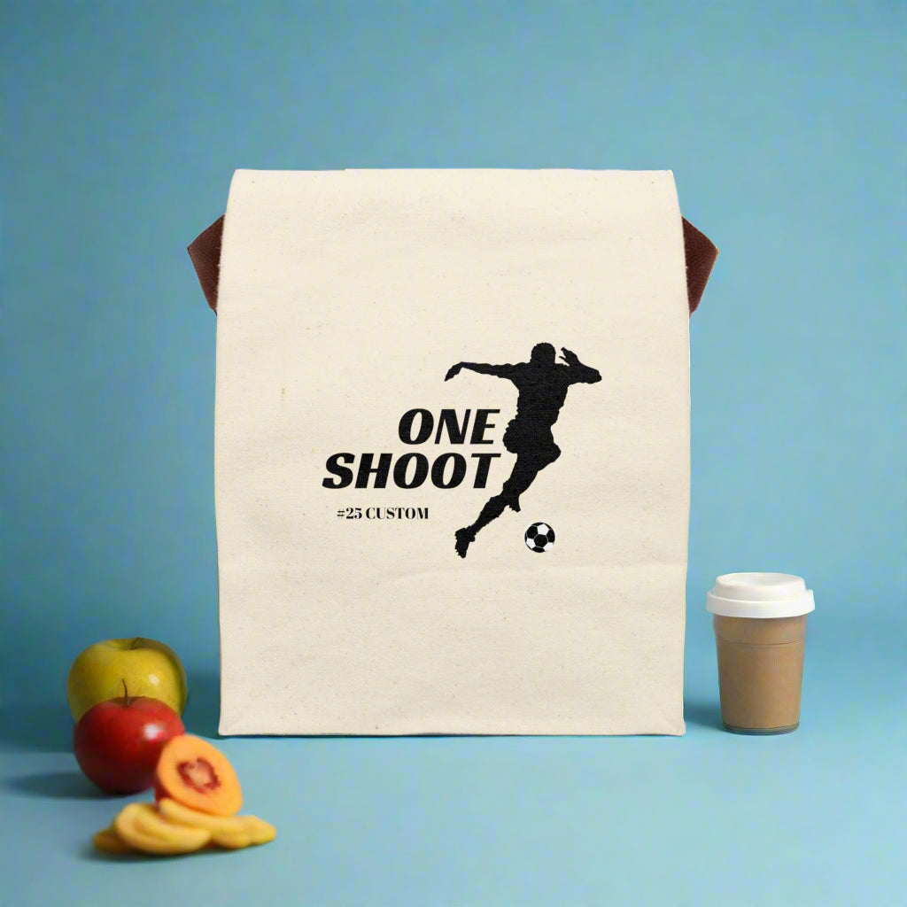 Beige towel with a black silhouette of a soccer player and text on a white background